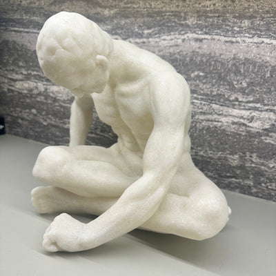White Sitting Male Sculpture