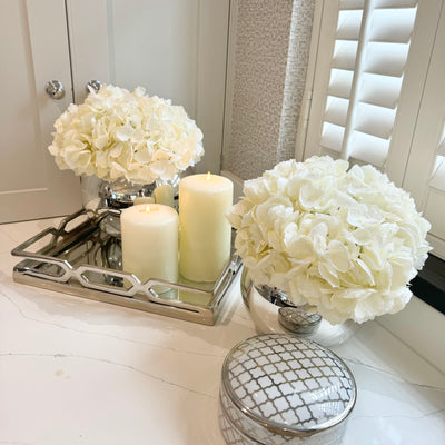 White Hydrangeas in Mirrored Fishbowl Vase