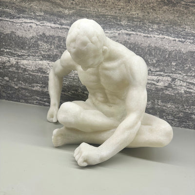 White Sitting Male Sculpture