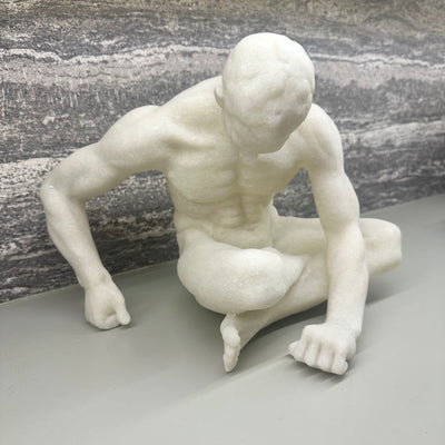 White Sitting Male Sculpture