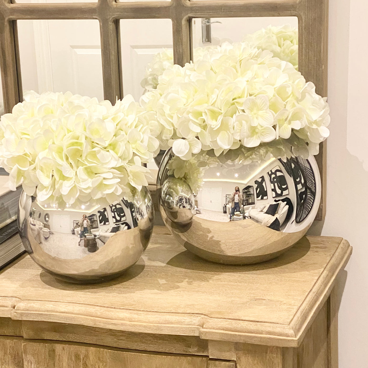 White Hydrangeas in Mirrored Fishbowl Vase