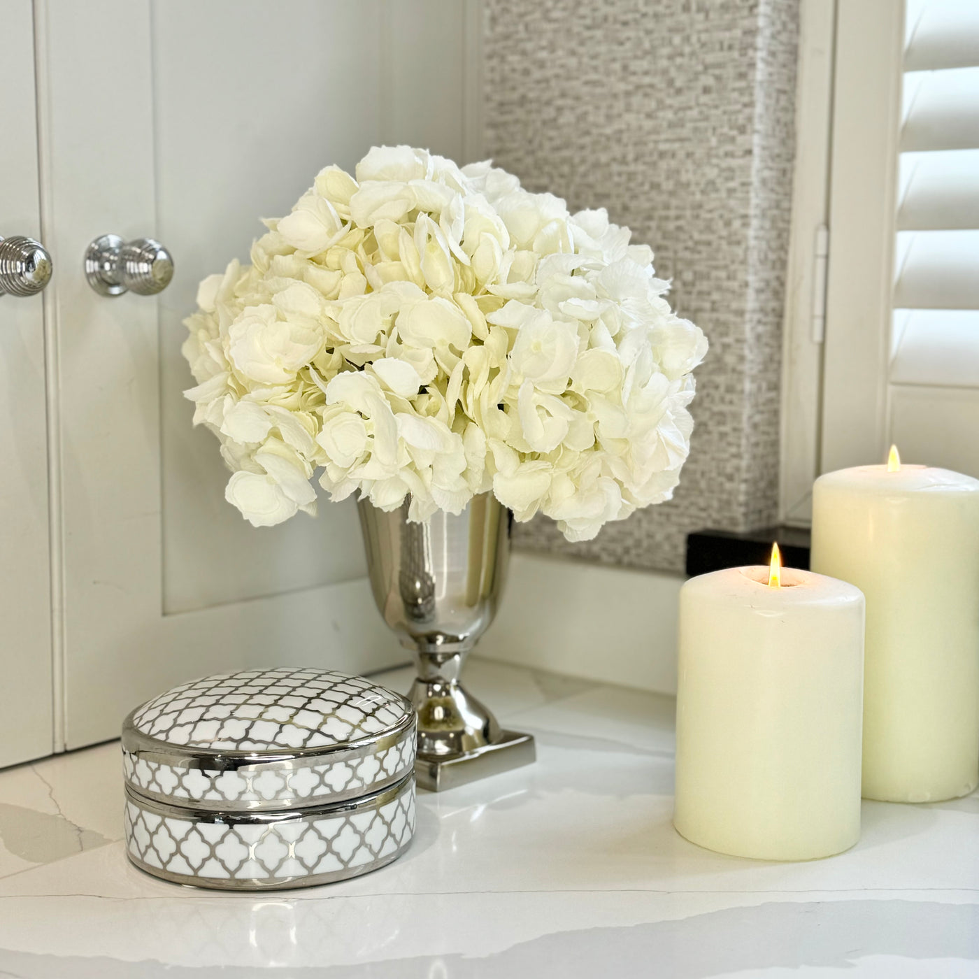 White Hydrangeas In Metal Goblet Vase